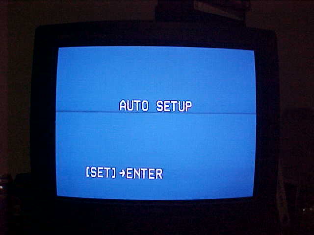 A blue screen with the text readin' AUTO SETUP on it, beamin' right into your eyes with CRT's.